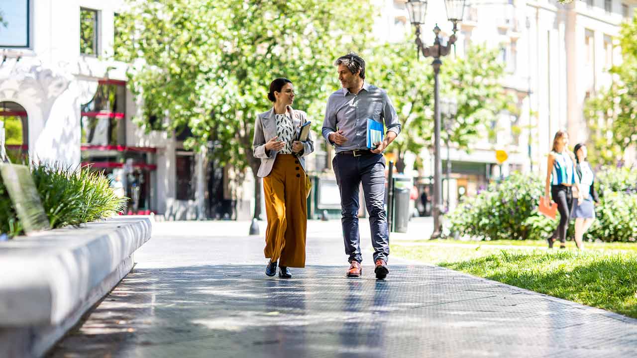 two businesspeople walking together